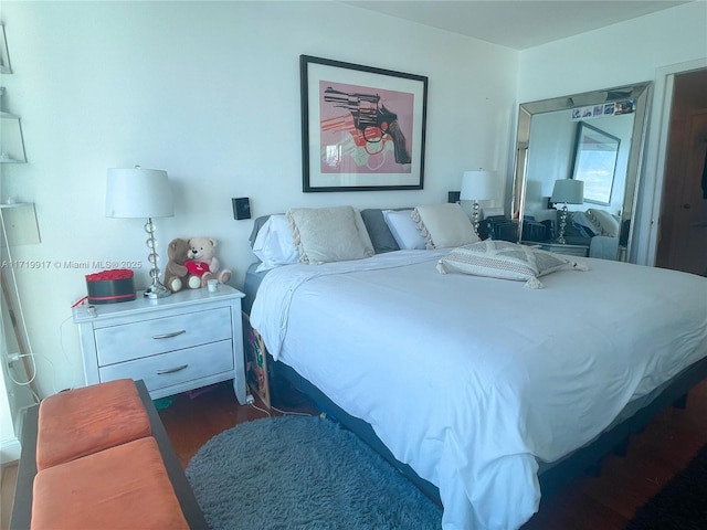 bedroom featuring dark hardwood / wood-style flooring