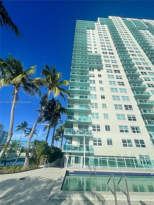 view of property featuring a community pool