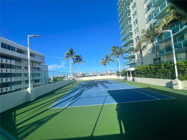 view of sport court featuring basketball hoop