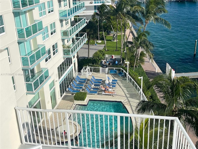 view of pool featuring a water view