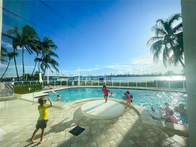 view of swimming pool with a patio