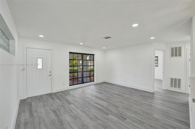 interior space with visible vents, wood finished floors, and recessed lighting