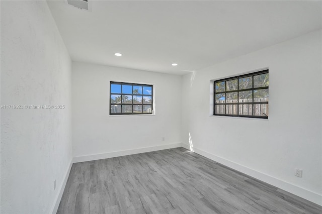 unfurnished room featuring light wood-type flooring