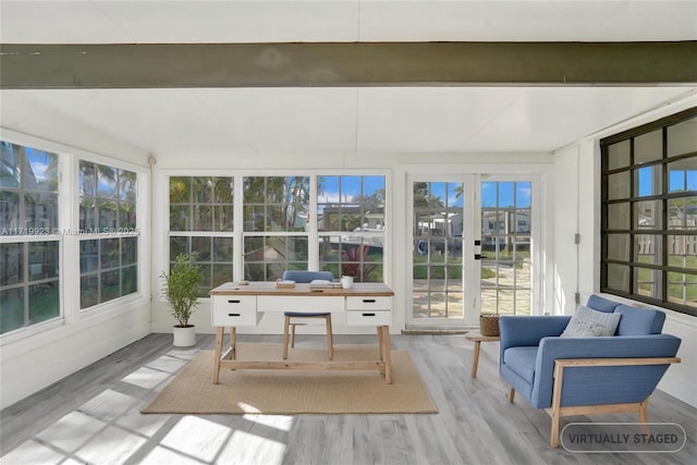 sunroom featuring beamed ceiling