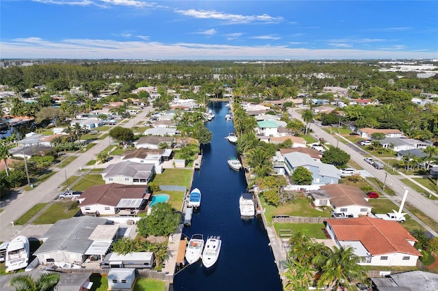 birds eye view of property featuring a residential view and a water view