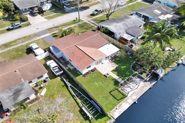 drone / aerial view with a residential view and a water view