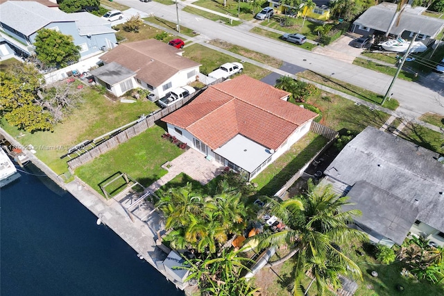 birds eye view of property featuring a water view and a residential view