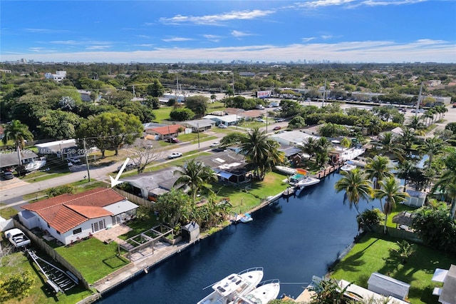 drone / aerial view with a residential view and a water view