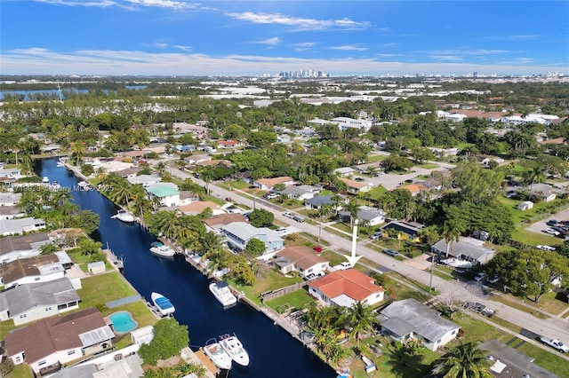 drone / aerial view with a water view and a residential view