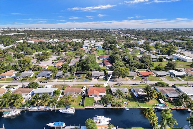 birds eye view of property with a water view and a residential view