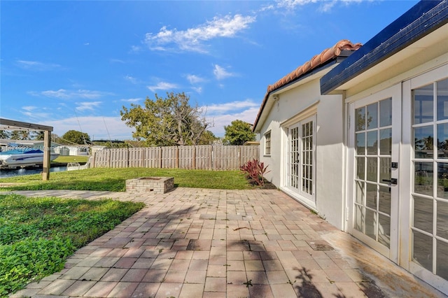 view of patio / terrace with fence and french doors