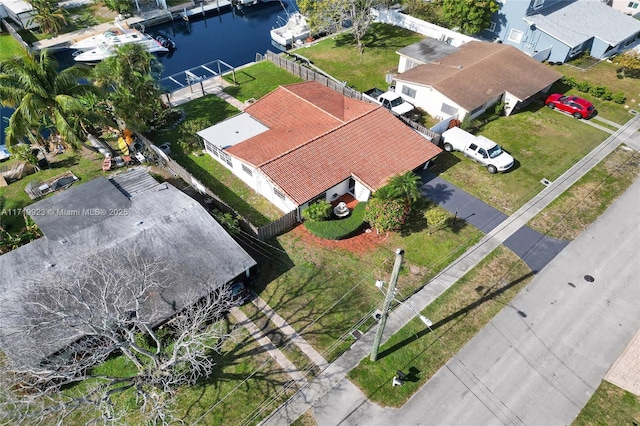 bird's eye view with a water view and a residential view