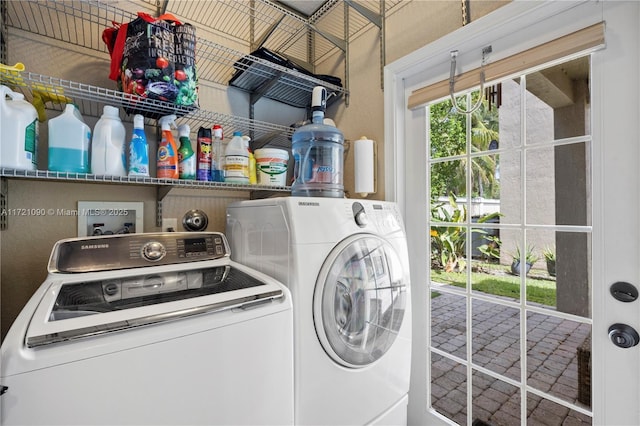 washroom featuring washing machine and dryer