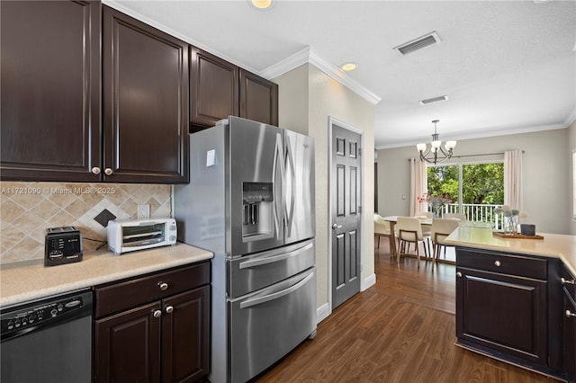 kitchen featuring dishwashing machine, hanging light fixtures, stainless steel refrigerator with ice dispenser, a chandelier, and decorative backsplash