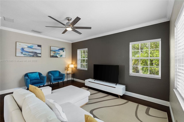 living room featuring crown molding, ceiling fan, and hardwood / wood-style flooring