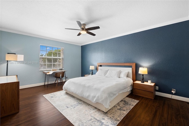 bedroom featuring dark hardwood / wood-style flooring, ceiling fan, and ornamental molding