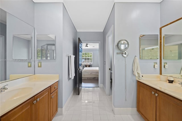 bathroom with tile patterned floors, vanity, and crown molding