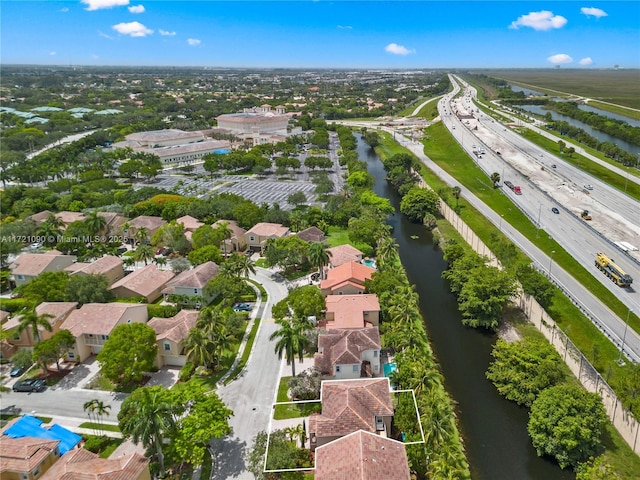 drone / aerial view with a water view