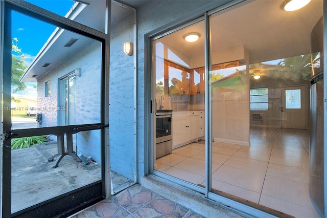 interior space with tile patterned floors and plenty of natural light