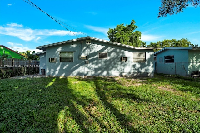 rear view of house with a lawn