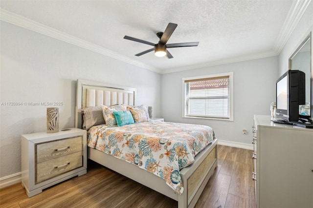 bedroom featuring a textured ceiling, dark hardwood / wood-style flooring, ceiling fan, and ornamental molding