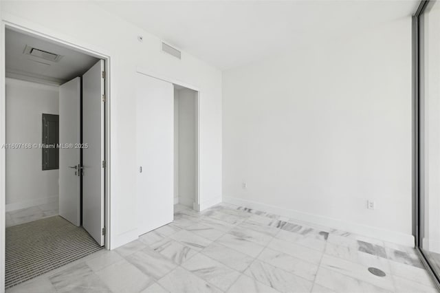 unfurnished room with electric panel