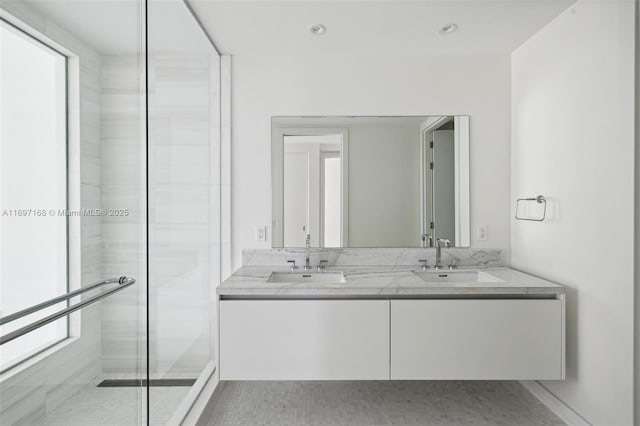 bathroom featuring tile patterned floors, vanity, and walk in shower