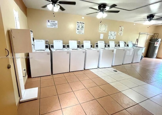 washroom with light tile patterned floors, washing machine and dryer, and ceiling fan