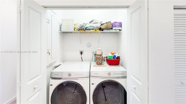 laundry room featuring washing machine and dryer