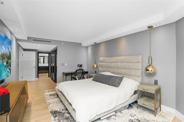 bedroom with light wood-type flooring