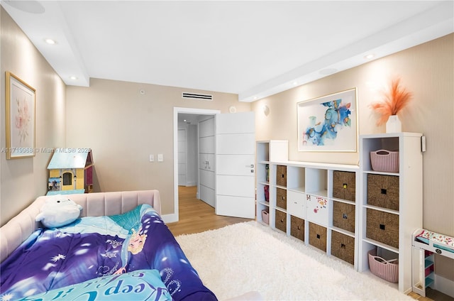 bedroom with light hardwood / wood-style floors