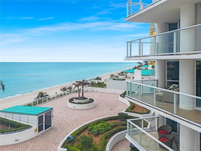 property view of water featuring a beach view