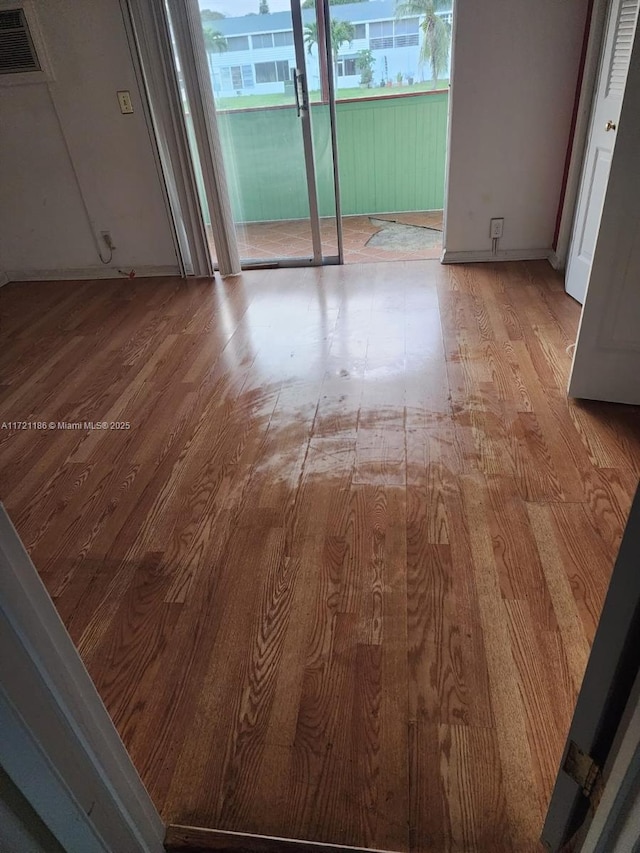 spare room with light hardwood / wood-style flooring