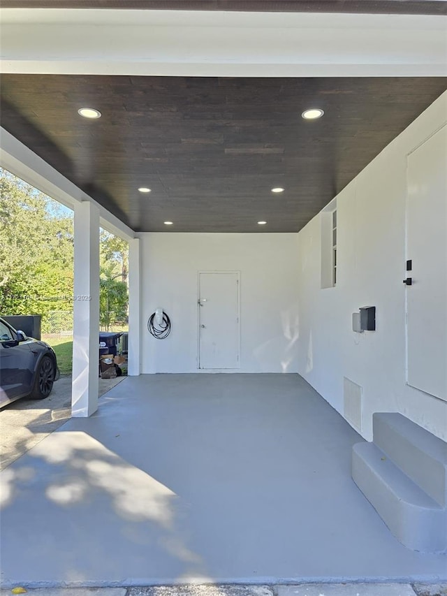 garage featuring a carport