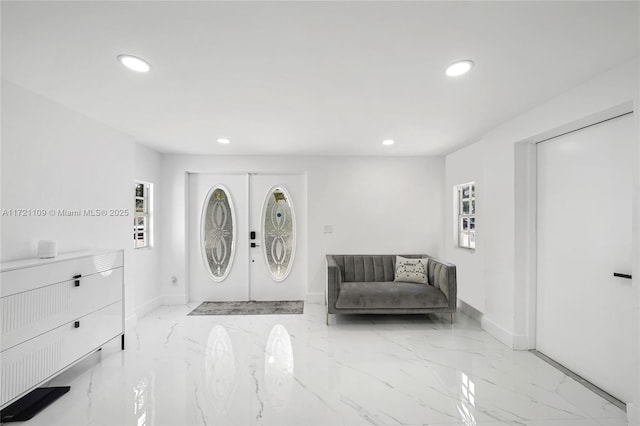 571 Raven Ave, Miami Springs, FL 33166 - entrance foyer featuring baseboards, recessed lighting, and marble finish floor