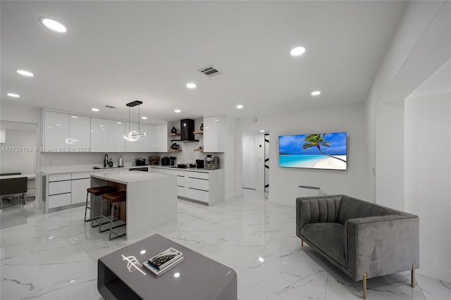 571 Raven Ave, Miami Springs, FL 33166 - living room featuring recessed lighting, marble finish floor, visible vents, and baseboards