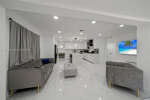 571 Raven Ave, Miami Springs, FL 33166 - living room with visible vents, recessed lighting, and marble finish floor