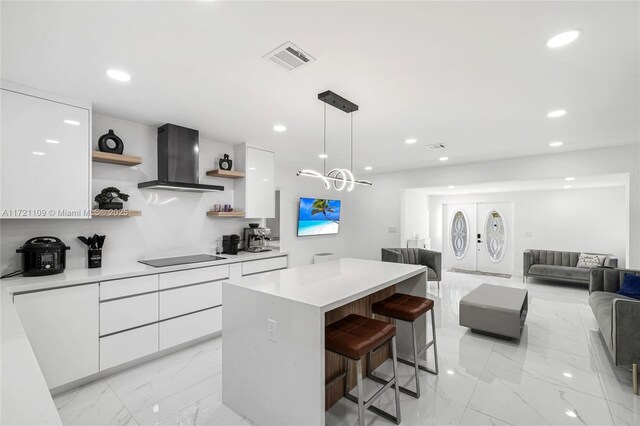 571 Raven Ave, Miami Springs, FL 33166 - kitchen with white cabinetry, open shelves, exhaust hood, modern cabinets, and marble finish floor