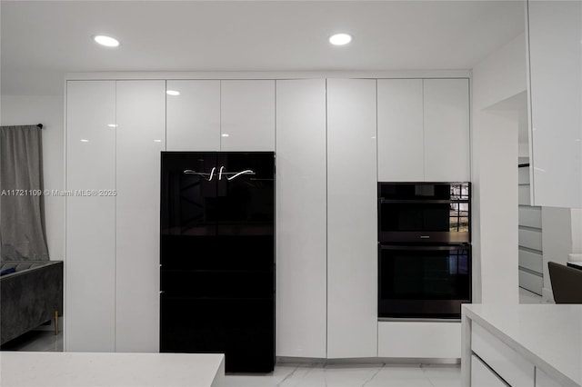571 Raven Ave, Miami Springs, FL 33166 - kitchen featuring white cabinetry, modern cabinets, and light countertops