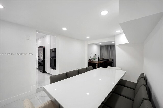571 Raven Ave, Miami Springs, FL 33166 - interior space with recessed lighting, marble finish floor, and baseboards