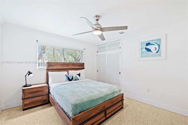 bedroom with ceiling fan, a closet, and crown molding