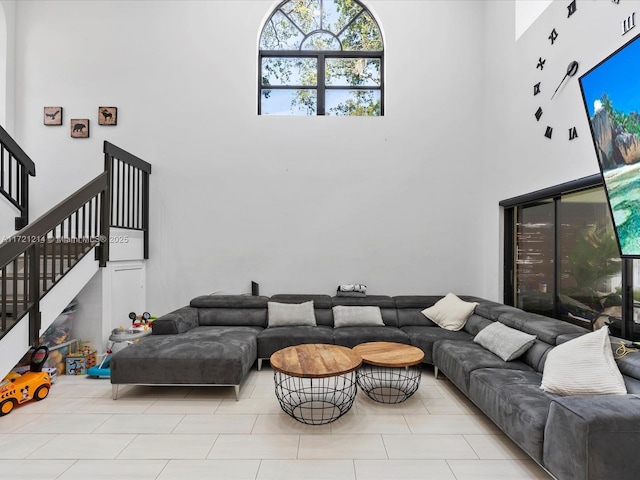 living room with a high ceiling