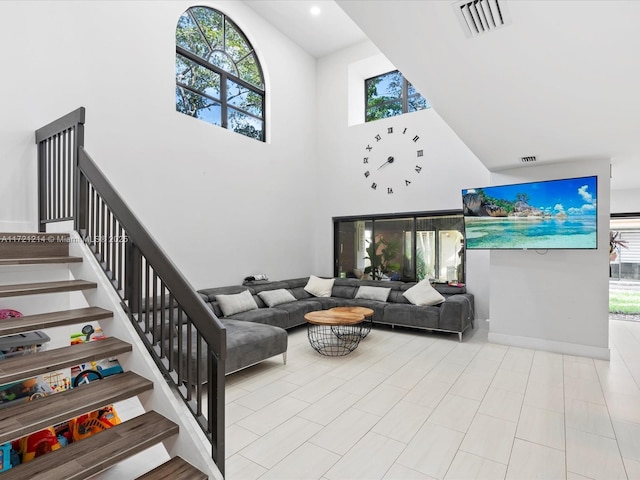 living room with a high ceiling