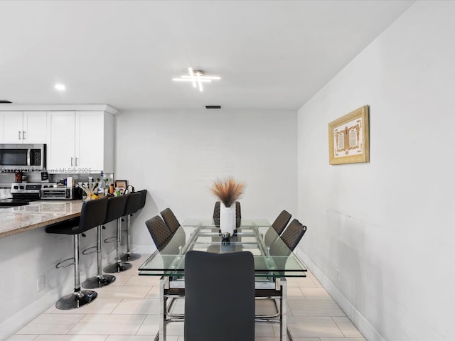 view of tiled dining space