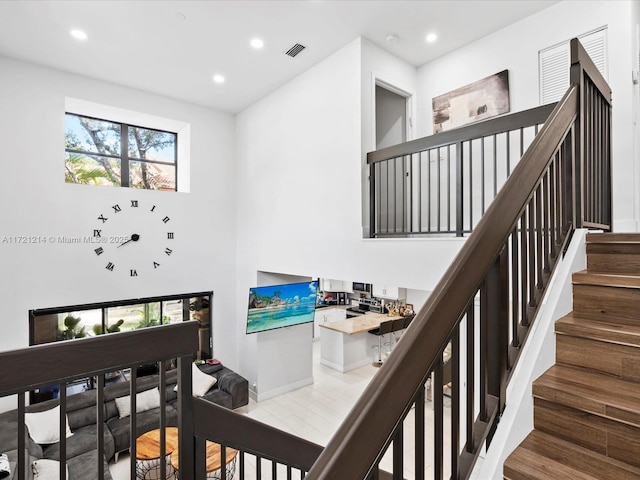 staircase featuring hardwood / wood-style flooring