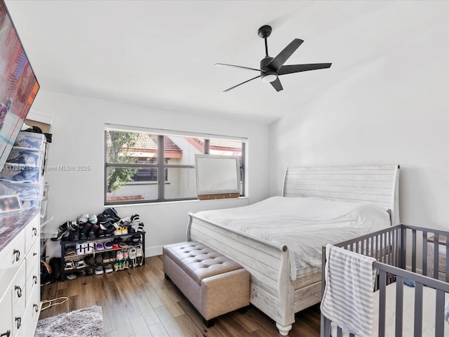 bedroom featuring ceiling fan and dark hardwood / wood-style flooring