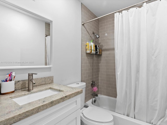 full bathroom featuring vanity, toilet, and shower / tub combo