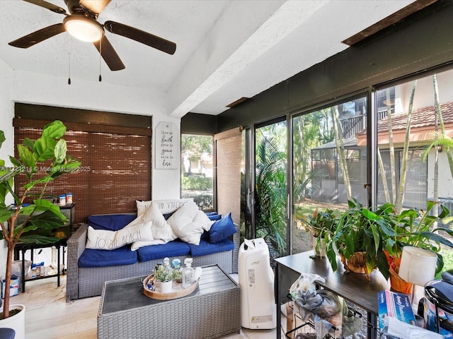 sunroom with ceiling fan