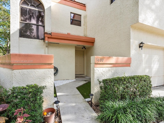 property entrance with a garage