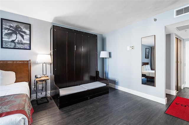 bedroom featuring dark hardwood / wood-style floors